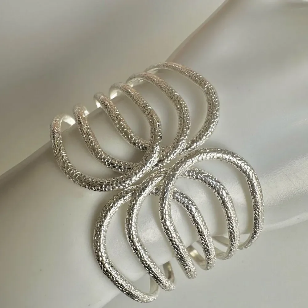 Silver tone textured hinged wide bracelet